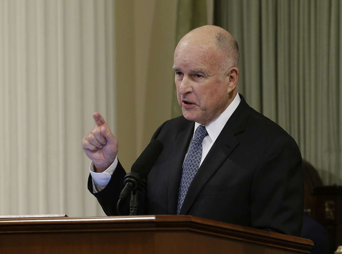 In this photo taken Thursday, Jan. 25, 2018, California Gov. Jerry Brown delivers his annual State of the State address in Sacramento, Calif. Brown called for putting 5 million zero-emission vehicles on California's roads by 2030 in his speech and on Friday issued an executive order and called for a $2.5 billion investment to help reach that goal. (AP Photo/Rich Pedroncelli)