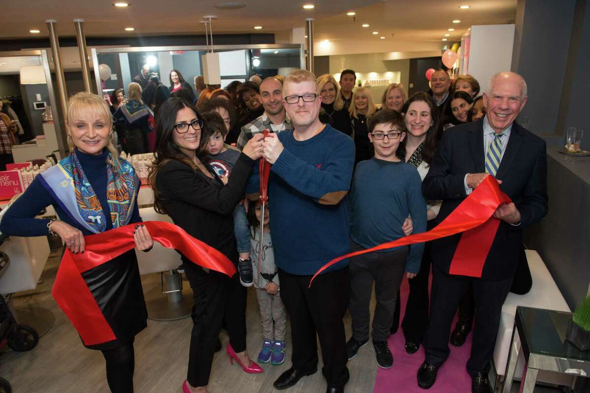 Greenwich Chamber of Commerce President Marcia O’Kane, left, owners Marianne and Bruce Hammer and Selectman Sandy Litvak, right, cut the ribbon at the Grand Opening of Blo, a blow-dry bar on Greenwich Avenue.