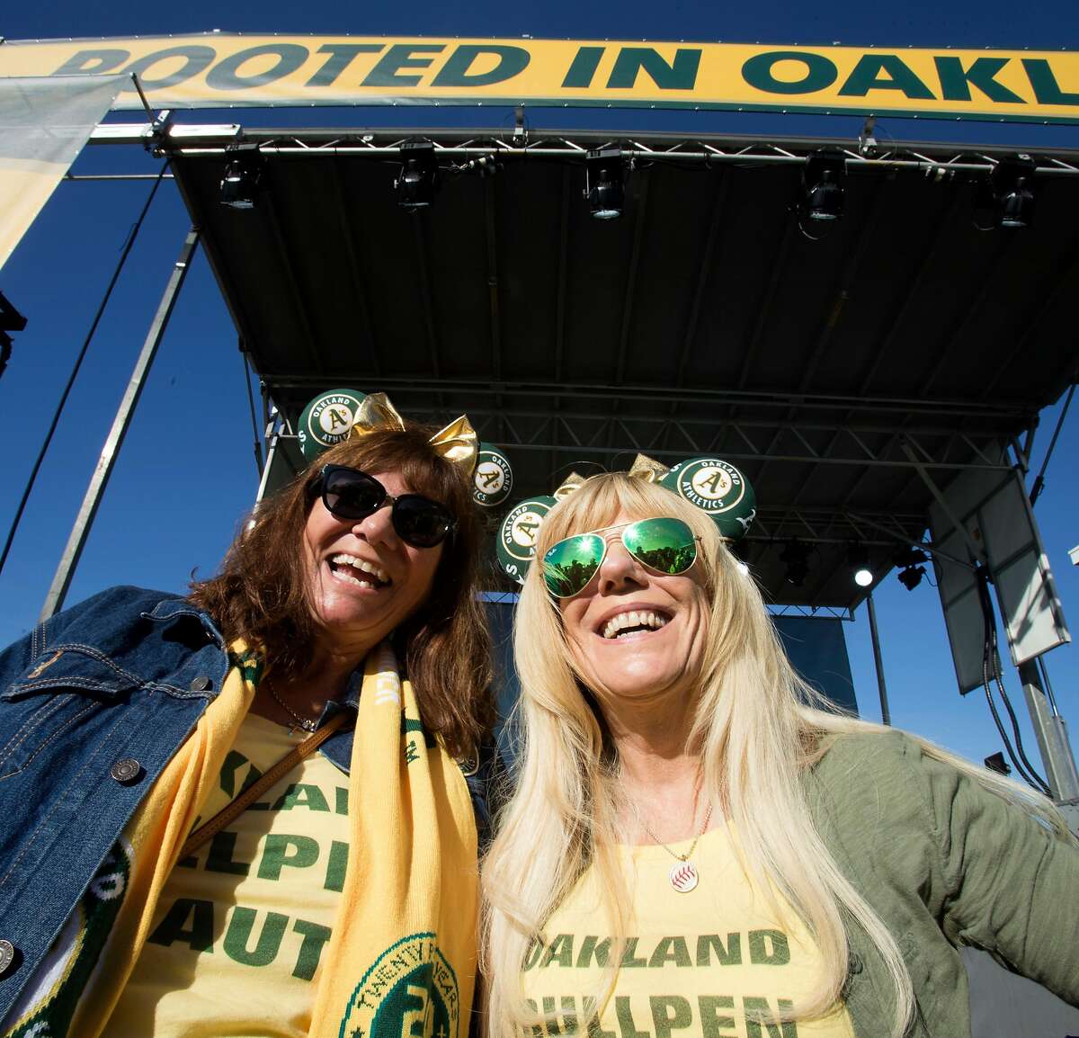 Alicia Puccinelli of San Jose, left, and Ane Smith of Livermore, Calif show off their A's paraphernalia during Oakland Athletics Fan Fest at Jack London Square on Saturday, Jan. 27, 2018 in Oakland, Calif.