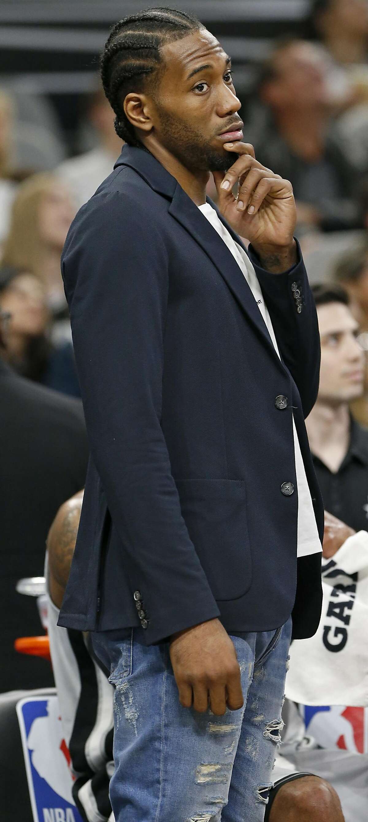 San Antonio Spurs' Kawhi Leonard stands near the bench during a timeout in first half action against the Indiana Pacers Sunday Jan. 21, 2018 at the AT&T Center.