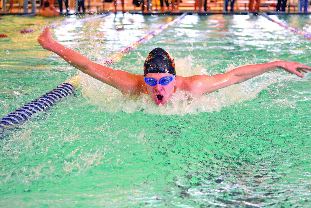 Edwardsville junior Henry Gruben competes in the 200-yard medley relay during Saturday’s five-team meet at Eisenhower Pool in Springfield. Gruben was part of the Tigers’ “B” relay, which finished third.