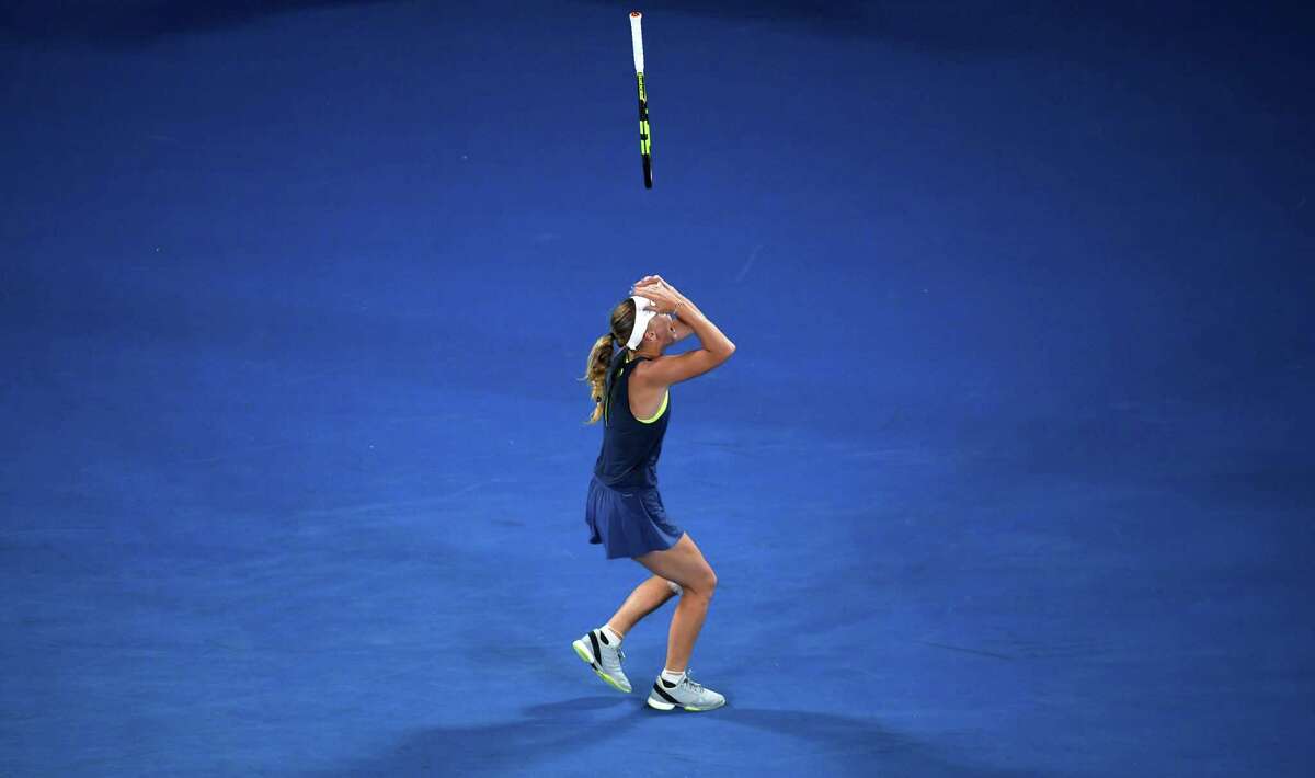 Denmark's Caroline Wozniacki celebrates beating Romania's Simona Halep in their women's singles final match on day 13 of the Australian Open tennis tournament in Melbourne on January 27, 2018. / AFP PHOTO / WILLIAM WEST / -- IMAGE RESTRICTED TO EDITORIAL USE - STRICTLY NO COMMERCIAL USE --WILLIAM WEST/AFP/Getty Images