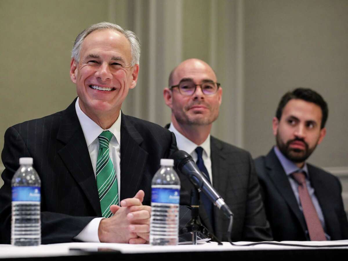 Governor Greg Abbott, from left, state Rep. Dennis Bonnen and David Garcia, a Harris County homeowner, are seen during a press conference about a new property tax proposal, at the Westin Galleria hotel, Tuesday, Jan. 16, 2018, in Houston. ( Jon Shapley / Houston Chronicle )