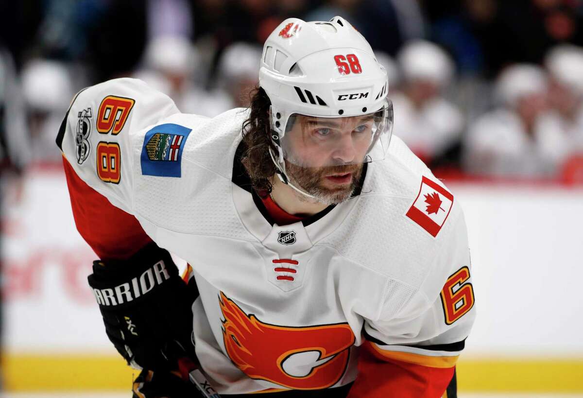 FILE - In this Nov. 25, 2017, file photo, Calgary Flames right wing Jaromir Jagr, of the Czech Republic, waits for a face-off against the Colorado Avalanche during the second period of an NHL hockey game in Denver. Multiple people with direct knowledge of the move say the Calgary Flames have placed Jagr on waivers. The people spoke to The Associated Press on condition of anonymity Sunday, Jan. 28, 2018, because the team had not announced the transaction. (AP Photo/David Zalubowski, File)