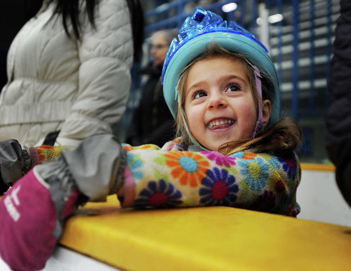 Kaelyn Albert, 3, of Newtown, is excited as she waits her turn to skate in a youth clinic with Olympic figure skater Isadora Williams at the Danbury Ice Arena in Danbury, Conn. on Sunday, January 28, 2018.
