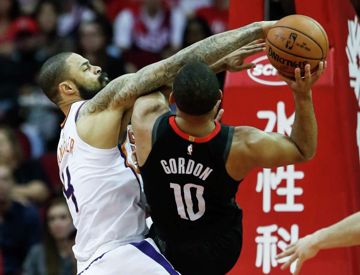 Phoenix Suns center Tyson Chandler (4) fouls Houston Rockets guard Eric Gordon (10) as he goes up for a shot during the second quarter of an NBA basketball game at Toyota Center on Sunday, Jan. 28, 2018, in Houston. ( Brett Coomer / Houston Chronicle )