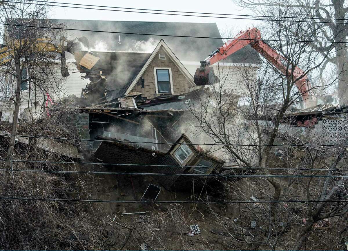 Demolition begins on the homes Barney Street after a weekend mudslide Monday, Jan. 29, 2018 in Schenectady, N.Y. (Skip Dickstein/Times Union)