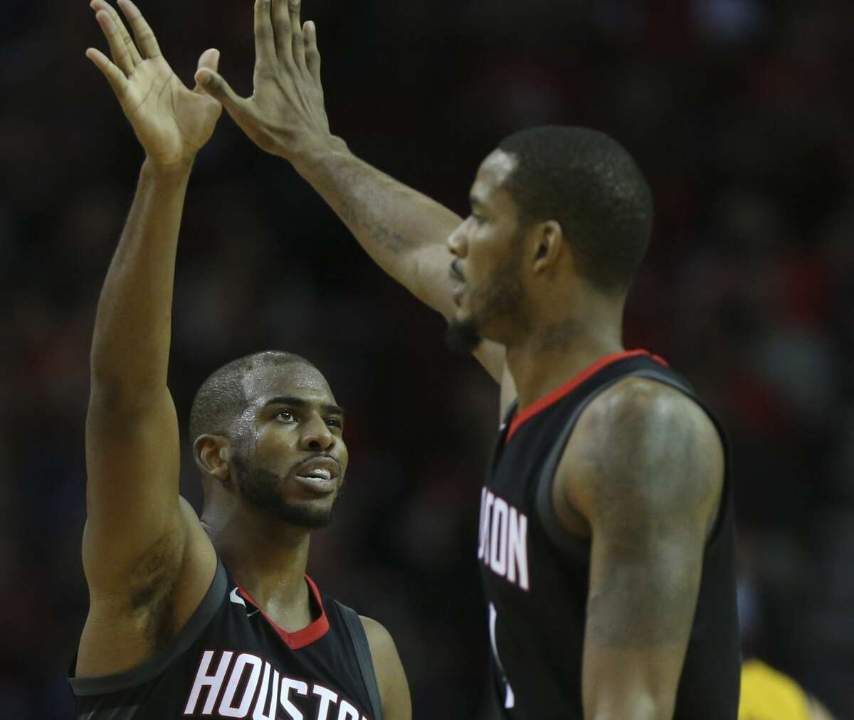 Houston Rockets guard Chris Paul (3) and forward Trevor Ariza (1) high-five each other during the fourth quarter of a NBA game against the Indiana Pacers at Toyota Center on Wednesday, Nov. 29, 2017, in Houston. The Houston Rockets defeated the Indiana Pacers 118-97. ( Yi-Chin Lee / Houston Chronicle )