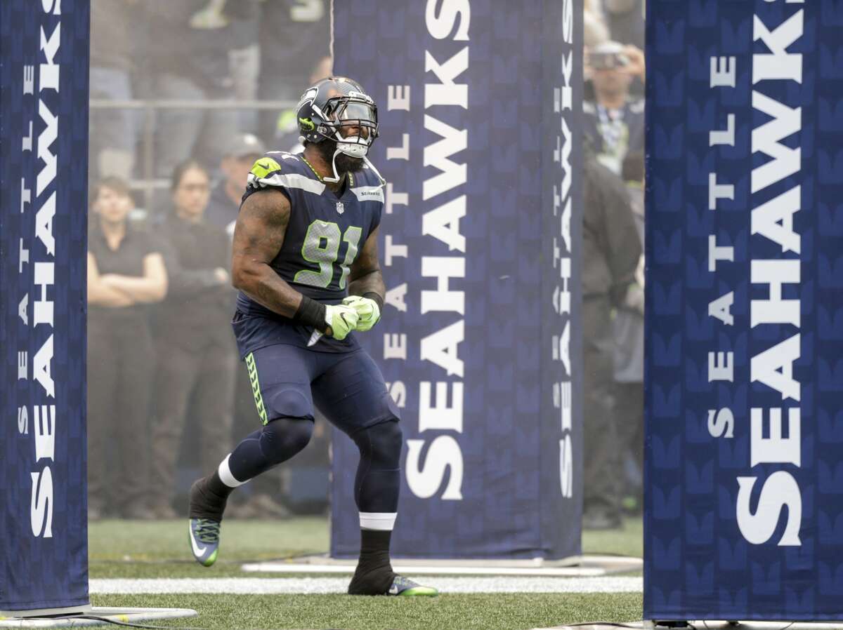 SEATTLE, WA - SEPTEMBER 17: Defensive lineman Sheldon Richardson #91 of the Seattle Seahawks runs on to the field during player introductions before a game against the San Francisco 49ers at CenturyLink Field on September 17, 2017 in Seattle, Washington. The Seahawks won the game 12-9. (Photo by Stephen Brashear/Getty Images)