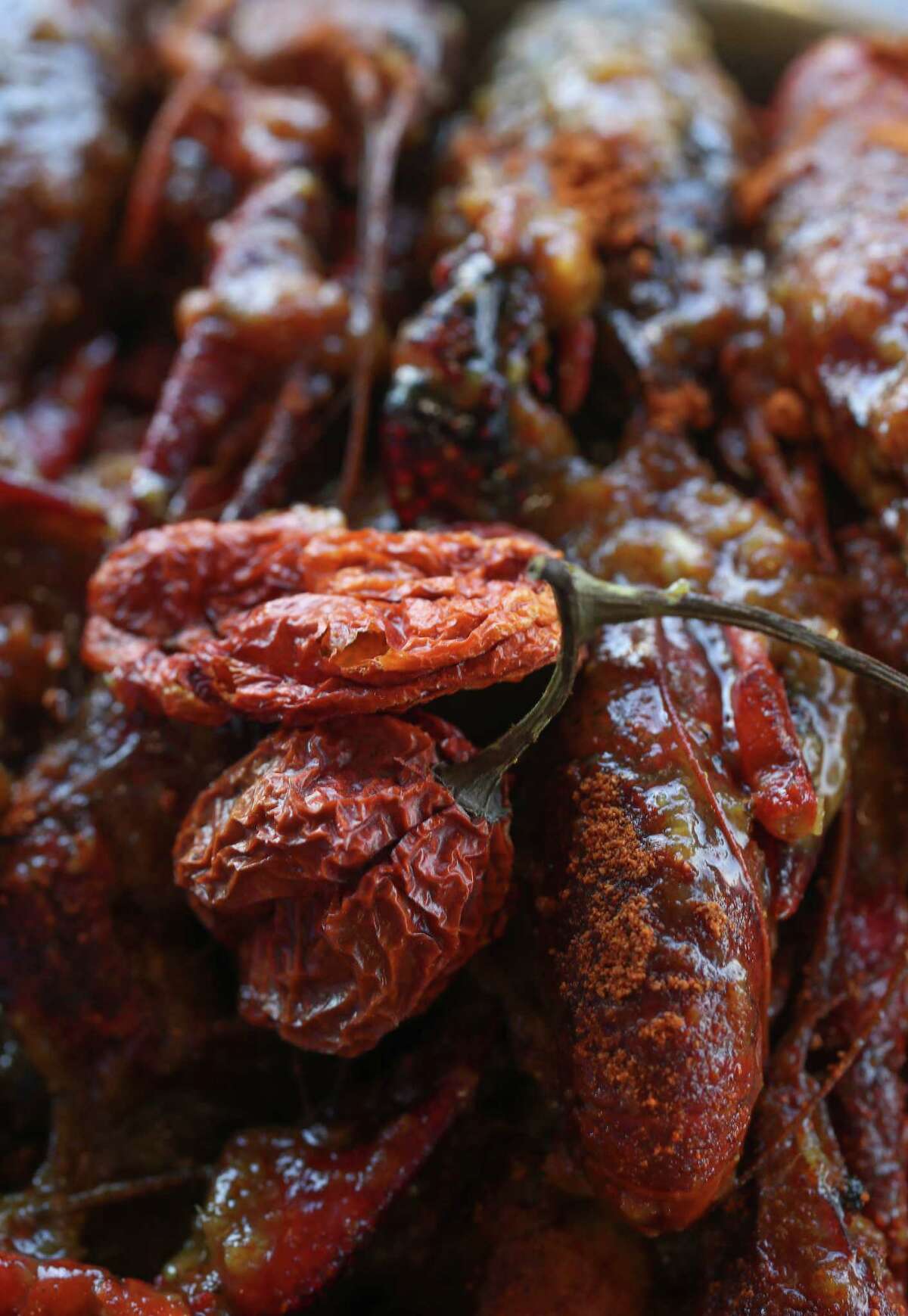 Casian Crawfish has created a Vietnamese-style Cajun crawfish dish coated in Carolina Reaper chile pepper, one of the world's hottest peppers.