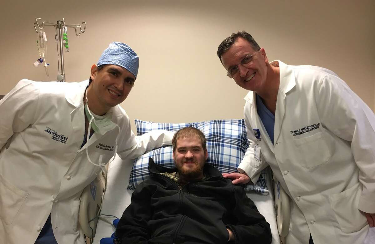 Dr. Erik Suarez and Dr. Thomas MacGillivray meet with heart transplant recipient Tyler Wertz. Both doctors performed the 1,000th heart transplant at Houston Methodist Hospital.