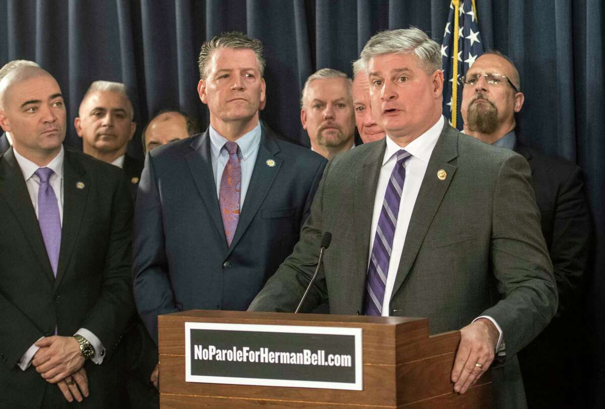 Thomas Mungeer, at podium, who had been president of the New York State Troopers Police Benevolent Association, stepped down in October as a group led by troopers from western New York sought to investigate the organization's finances and hiring decisions. (Skip Dickstein/Times Union)