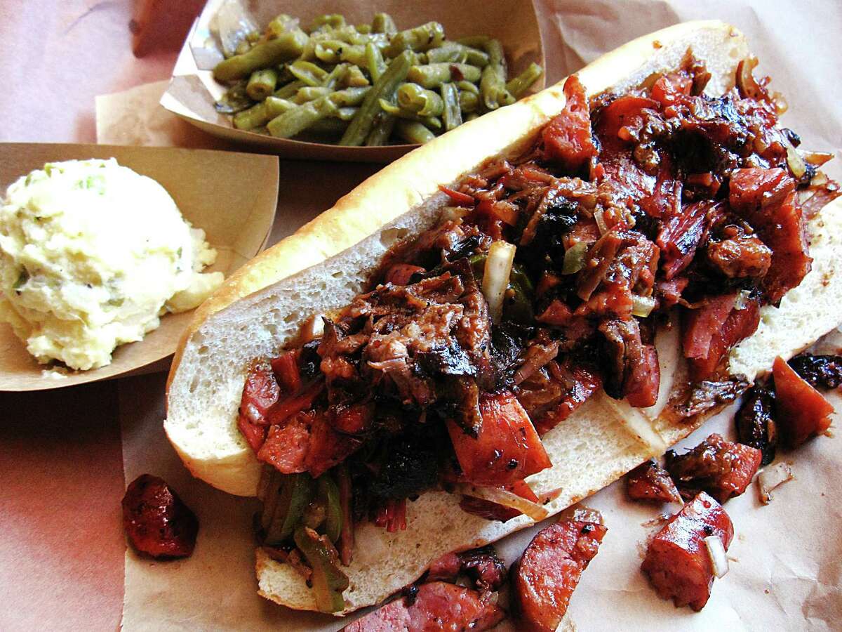 HARMON'S BARBECUE Harmon's features a combo sandwich with brisket and sausage with sides of potato salad and green beans. With a scuffed floor and scarred walls, Harmon’s looks like an Old West saloon — with an iced-down cooler full of beer and wine coolers to match. To read more from the report, click here. 102 S. Main St., Cibolo 210-658-8889 Hours vary and indoor dining is limited. Harmon's BBQ.com