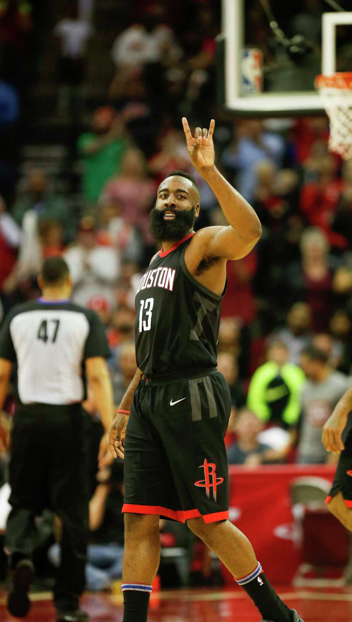 Houston Rockets guard James Harden (13) smiles at the crowd after scoring in the 4th-quarter of an NBA basketball game at Toyota Center on Tuesday, Jan. 30, 2018, in Houston.