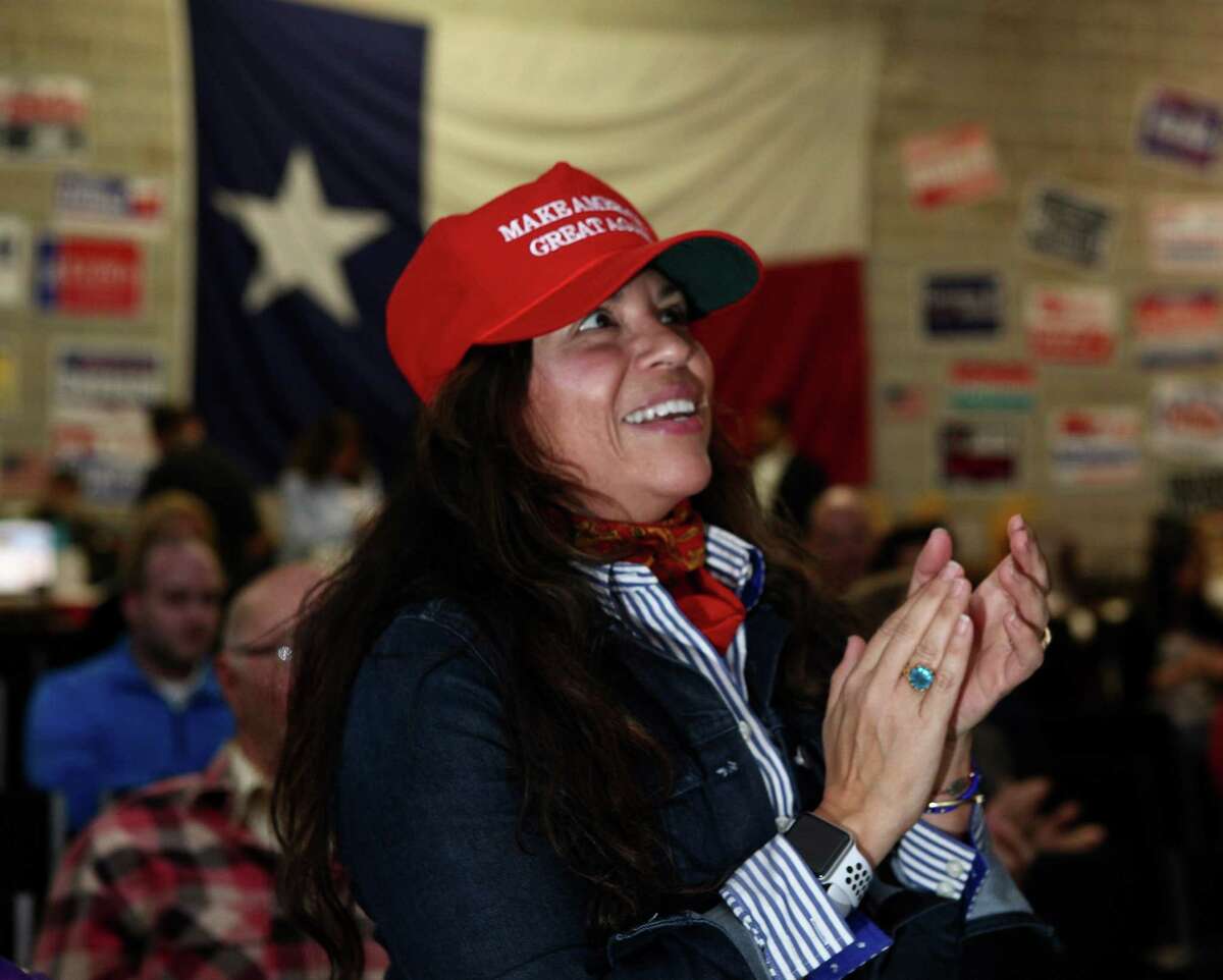 Elisa Sharp, in red hat, cheers at the beginning of the State of the Union speech during a watch party at the Harris County Republican Party headquarters, Tuesday, January 30, 2018, in Houston. Sharp emigrated to the United States from Mexico as a child when her father, and engineer, obtained a green card to work in the United States. Sharp became a citizen when she turned 18 in 1983.