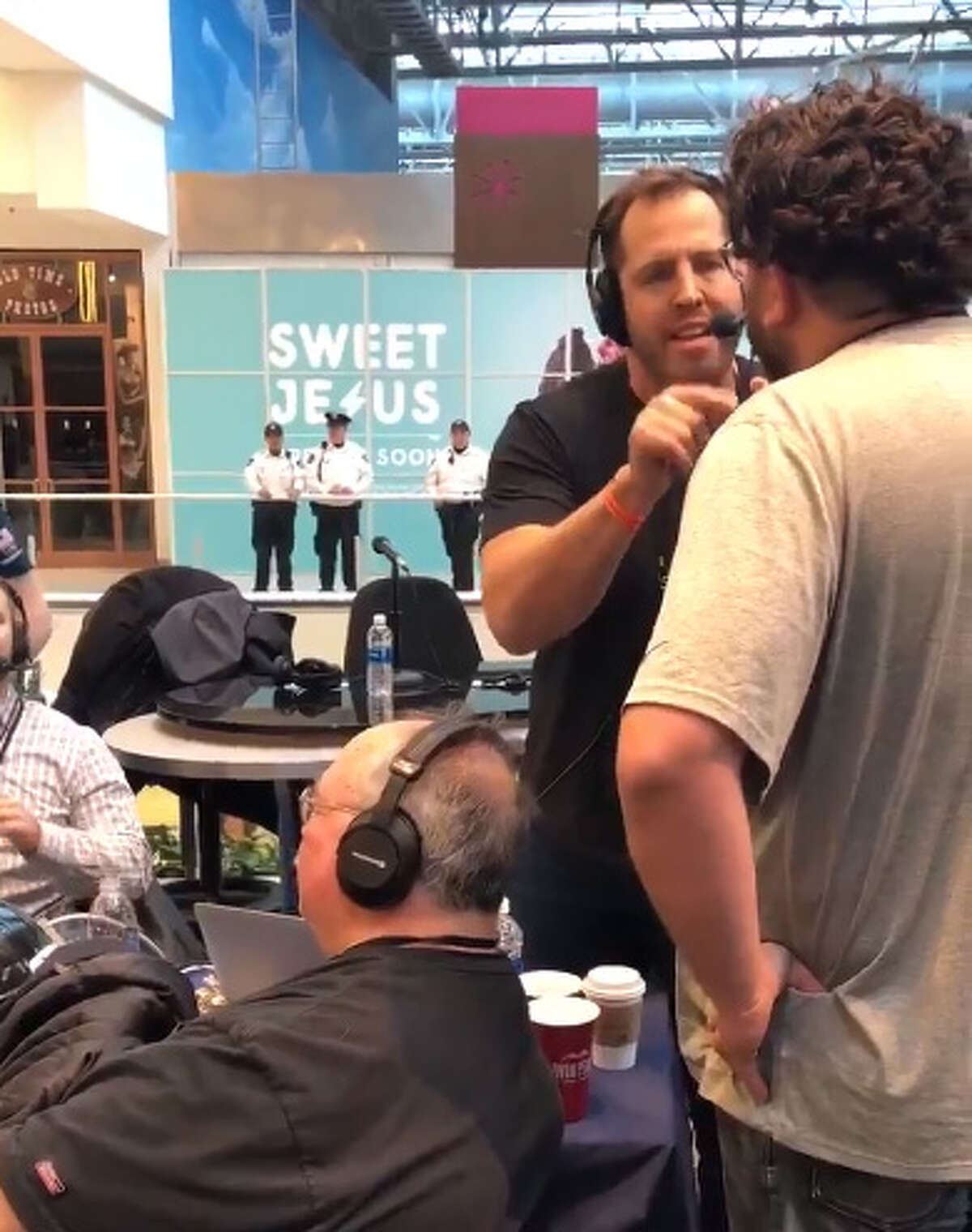 Rival Houston sports talk radio hosts Seth Payne and Josh Innes (left) argue live on the air from Super Bowl's Radio Row on Wednesday, Jan. 31, 2018. The Houston Chronicle's John McClain is sitting on the left, waiting impatiently.