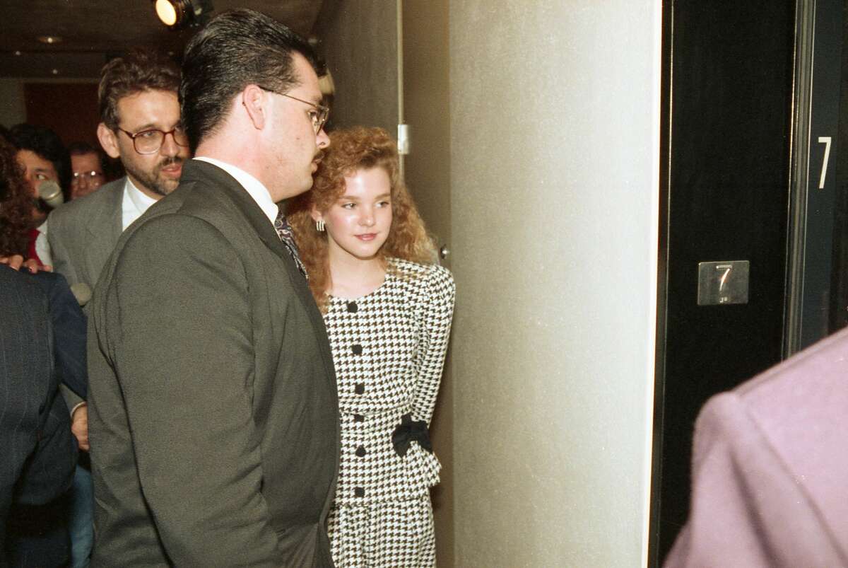 March 1991: Shanna Harper with attorneys at the Harris County Family Courts building. Harper's mother, Wanda Webb Holloway, is accused of trying to hire a hit man to boost her daughter's chances for becoming a high school cheerleader.