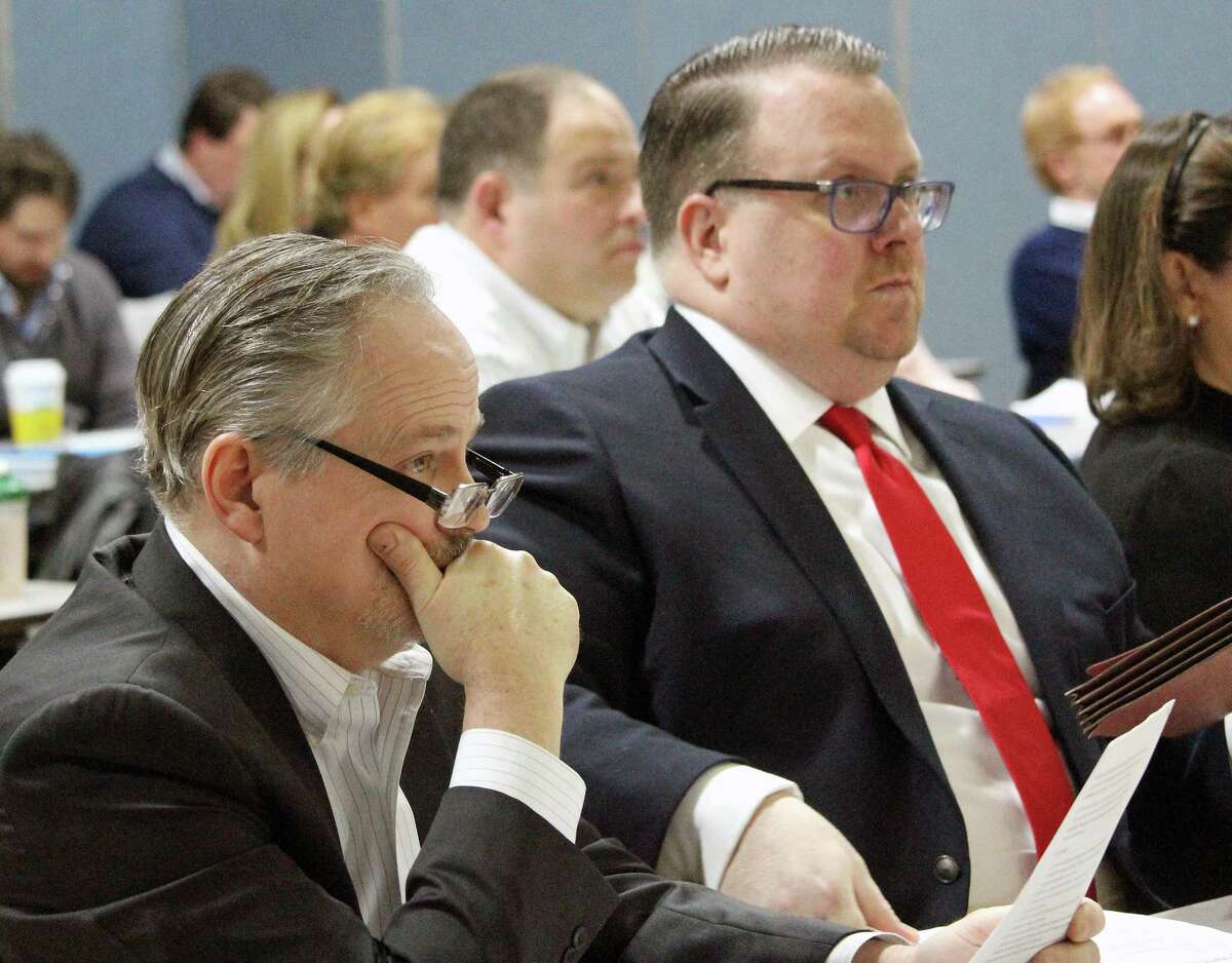 From left, Republicans Edward Bateson, and Deputy Minority Leader Michael Herley, listen to the first selectman's State of the Town address. Herley delivered the GOP response. Fairfield,CT. 1/29/18