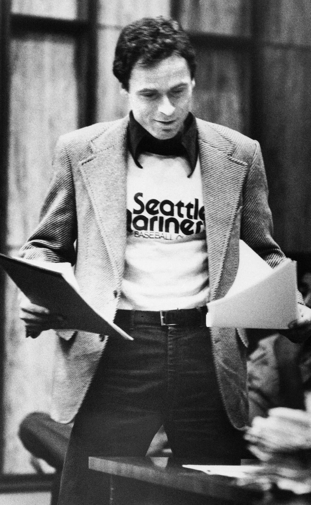 Accused serial killer Ted Bundy wears a Seattle Mariners T-shirt in court in Miami, July 5, 1979, as he presented his own motions and made a request for a typewriter in his Dade County jail cell.
