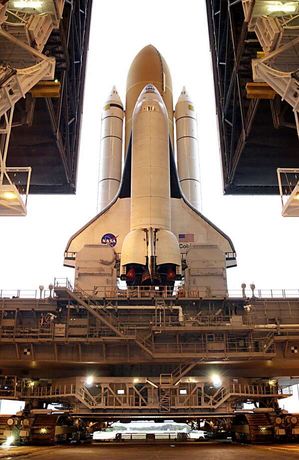 Space Shuttle Columbia, atop the Mobile Launcher Platform, approaches the top of Launch Pad 39A where it will undergo preparations for launch : lift-off on January 26, 2003,Shuttle broke up at re-entry on February 1, 2003. Photo: Apic/Getty Images