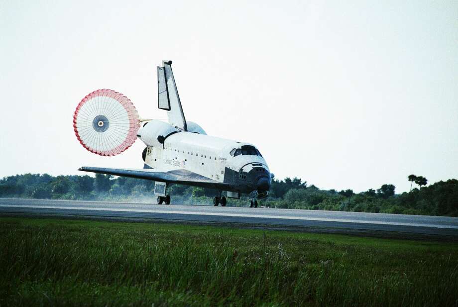 A parachute open behind the Space Shuttle Columbia as it lands at Kennedy Space Center in Florida. Photo: Historical/Corbis Via Getty Images