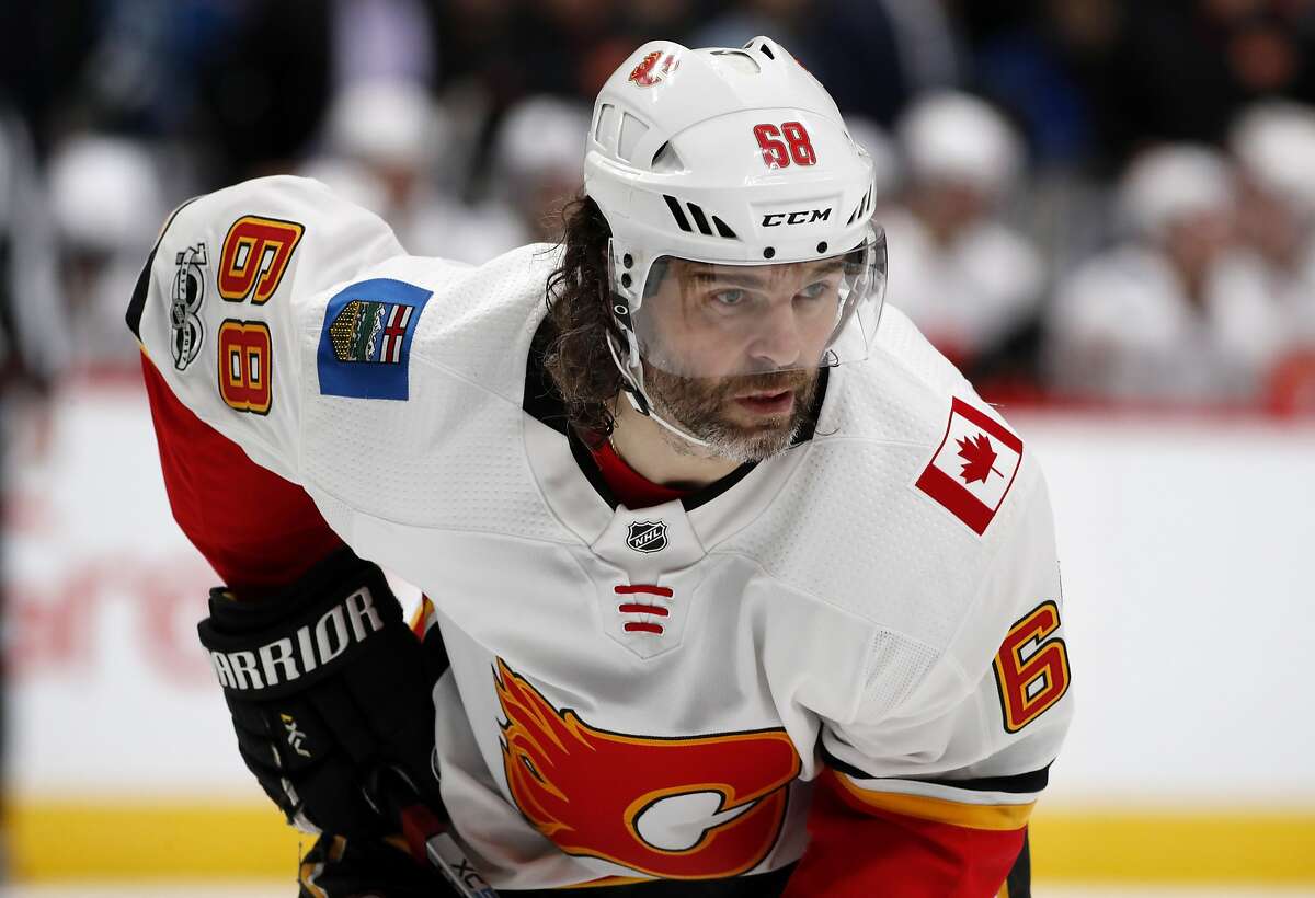 FILE - In this Nov. 25, 2017, file photo, Calgary Flames right wing Jaromir Jagr, of the Czech Republic, waits for a face-off against the Colorado Avalanche during the second period of an NHL hockey game in Denver. Multiple people with direct knowledge of the move say the Calgary Flames have placed Jagr on waivers. The people spoke to The Associated Press on condition of anonymity Sunday, Jan. 28, 2018, because the team had not announced the transaction. (AP Photo/David Zalubowski, File)