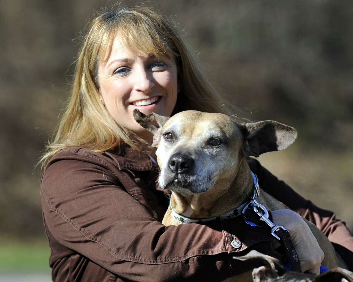 Laurie Hollywood, Stamford's former animal control manager is photographed with her dogs at her Newtown, Conn. home, Thursday, April 30, 2015.