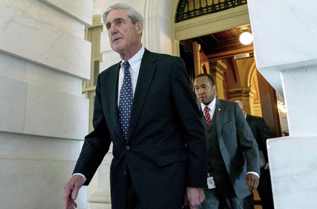Former FBI Director Robert Mueller, the special counsel probing Russian interference in the 2016 election, departs Capitol Hill following a closed door meeting in June. Depending on whether you’re a Texas Democrat or Republicans, people believe Trump is already guilty or the investigation is wrongheaded.