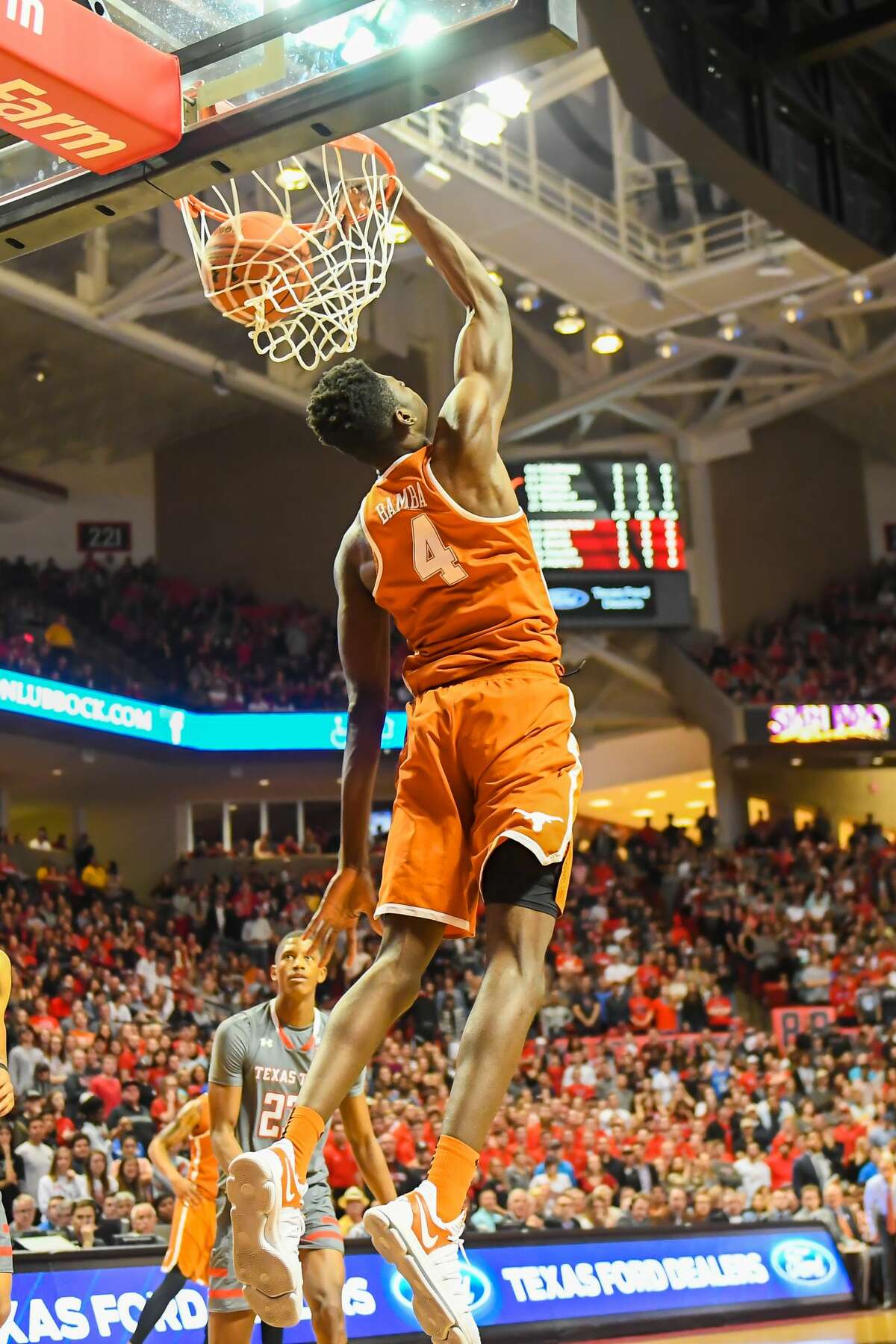 LUBBOCK, TX - JANUARY 31: Mohamed Bamba #4 of the Texas Longhorns dunks the basketball during the first half of the game against the Texas Tech Red Raiders on January 31, 2018 at United Supermarket Arena in Lubbock, Texas. (Photo by John Weast/Getty Images)