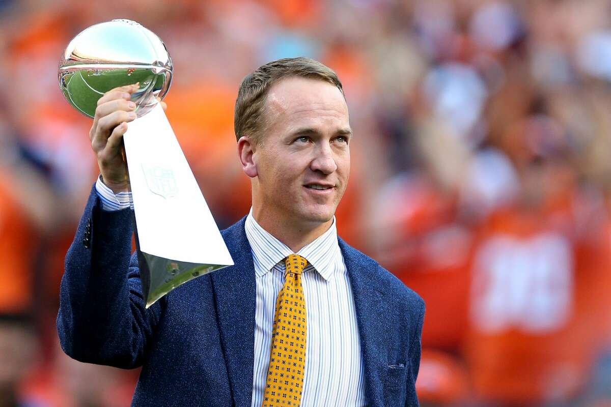 DENVER, CO - SEPTEMBER 08: Peyton Manning holds the Lombardi Trophy to celebrate the Denver Broncos in win Super Bowl 50 at Sports Authority Field at Mile High before taking on the Carolina Panthers on September 8, 2016 in Denver, Colorado. (Photo by Justin Edmonds/Getty Images)