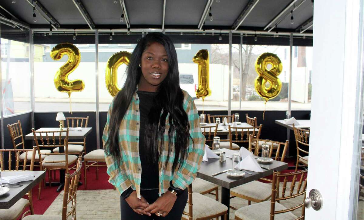 Melissa Gorman, stands in the restaurant bar she co-owns, 190 Main, which opened in December.