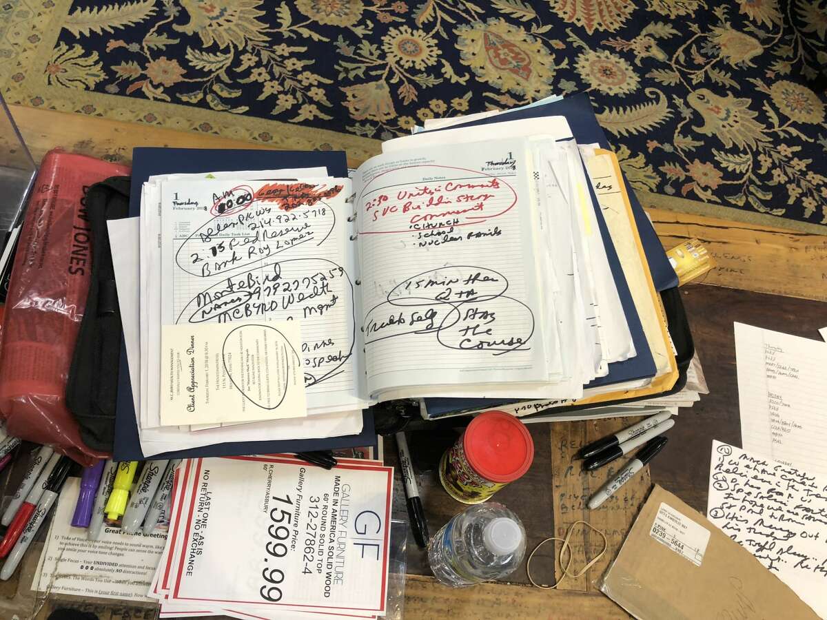 Mattress Mack's most-prized possession. His day planner, overflowing with names and numbers. 