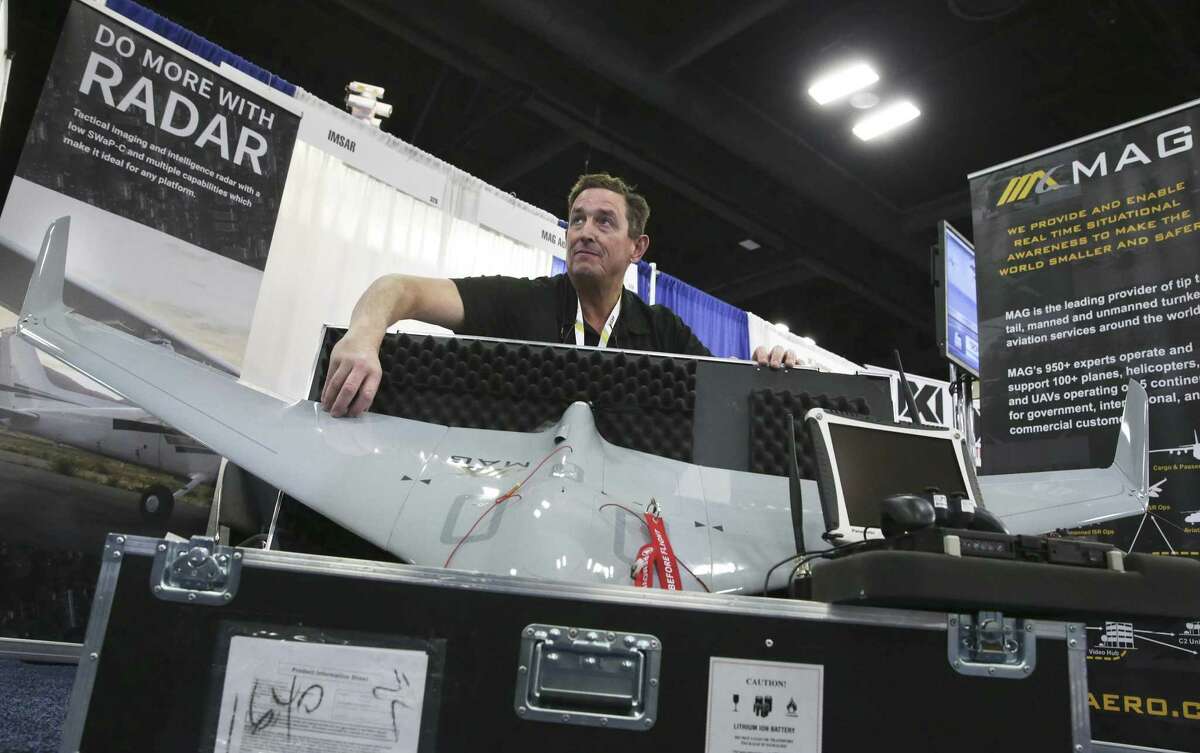 Jim Finell displays Mag Aerospace's stealthy drone which can stay flying for 3 hours during the Border Security Expo at the Henry B. Gonzalez Covention Center on January 31, 2018.