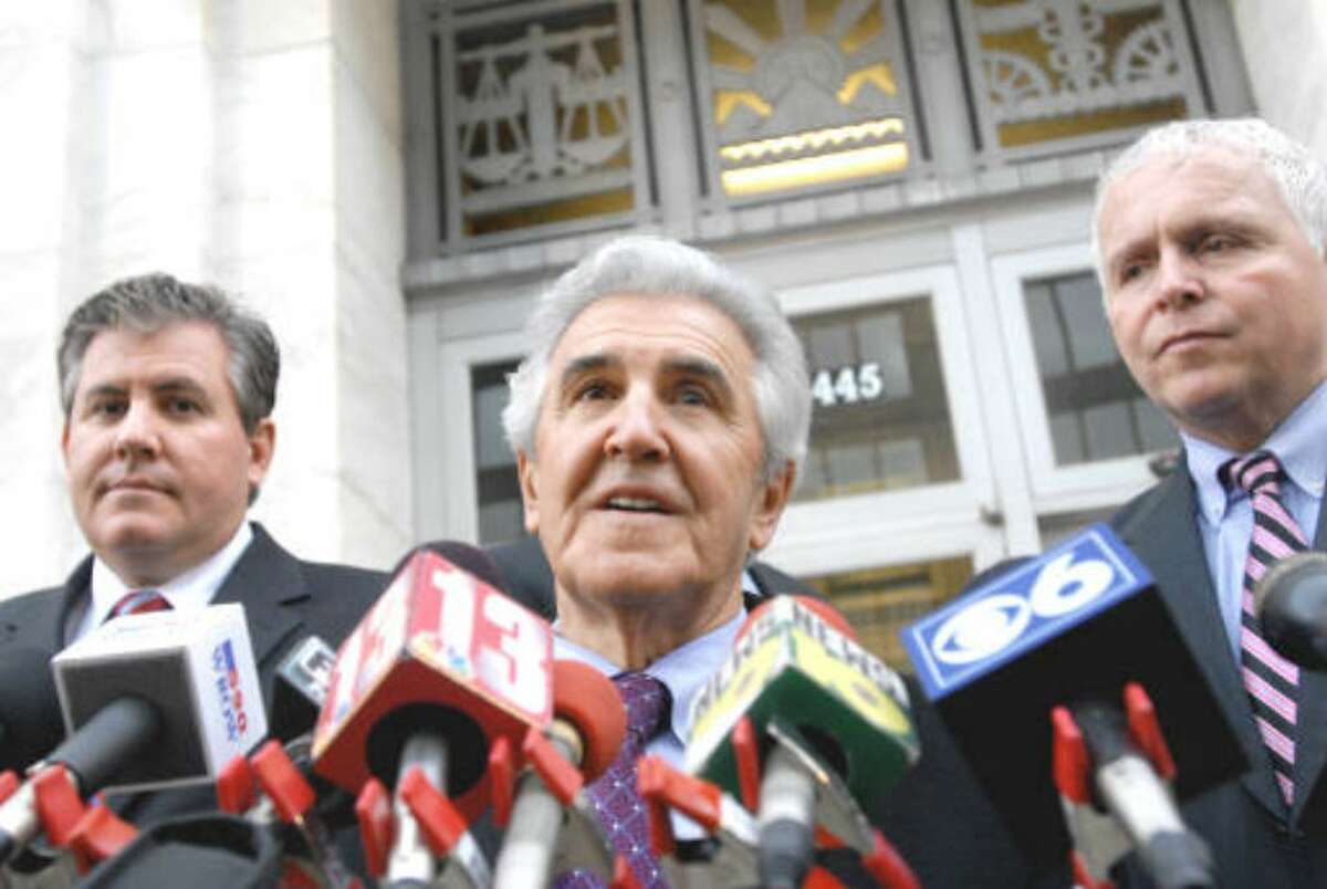 Joseph Bruno, center, flanked by son Kenneth Bruno, left, and Chris Thompson, right, speaks to the media after a day of jury deliberations on Friday, Dec. 4, 2009, at the federal courthouse in Albany, N.Y. (Cindy Schultz / Times Union)