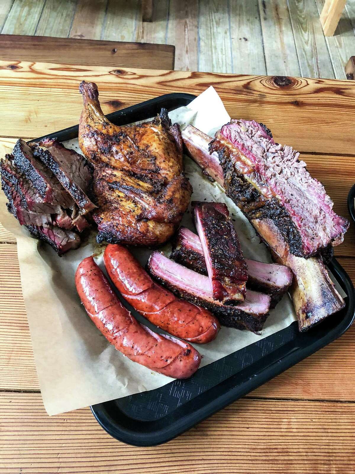 The "trinity" of brisket, pork ribs and sausage Malekian makes by hand, along with chicken and beef ribs, are on the menu.