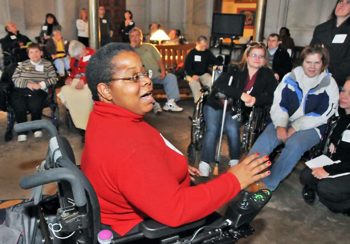 Shameka Andrews of the Self Advocacy Association of N.Y., speaks with family members and people with developmental disabilities during a vigil outside Gov. Paterson's office at the state Capitol Thursday afternoon November 5, 2009. The group is hoping to speak with Gov. David Paterson to warn of the effects of proposed budget cuts. (John Carl D'Annibale / Times Union)