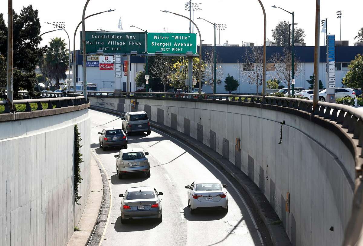 Cars emerge from the Webster Street Tube into Alameda, Calif. on Friday, Feb. 2, 2018. The Alameda City Council will vote on a plan to install license plate readers at all entry points into the island city.