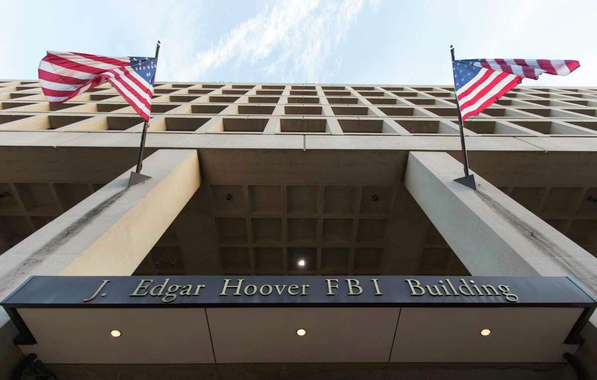 The Pennsylvania Avenue entrance of the J. Edgar Hoover Federal Bureau of Investigation Building is seen in Washington on Nov. 30, 2017. (AP Photo/Carolyn Kaster)