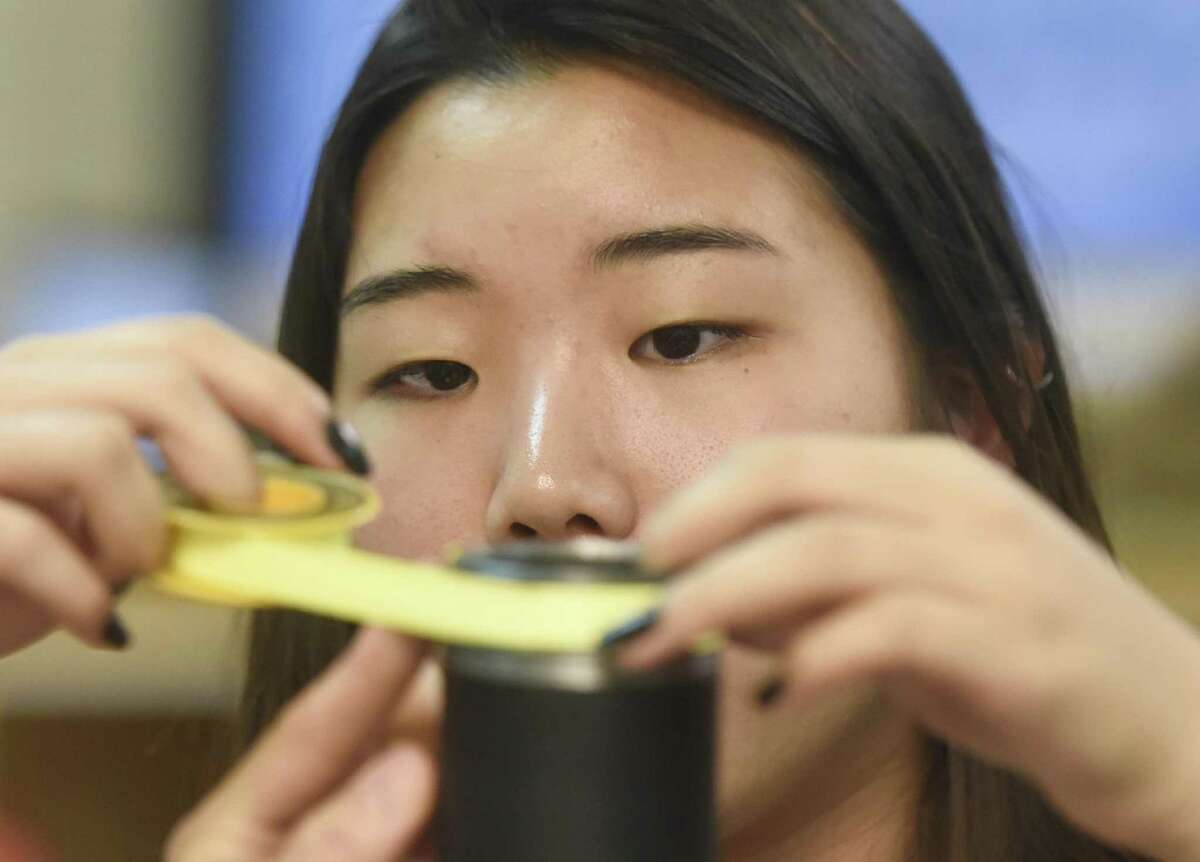 Junior Nina Hirai works on an air cannon project during an Innovation Lab class at Greenwich High School in Greenwich, Conn. Thursday, Sept. 28, 2017. Educators wans to expand the STEM-focused program to Western Middle School.