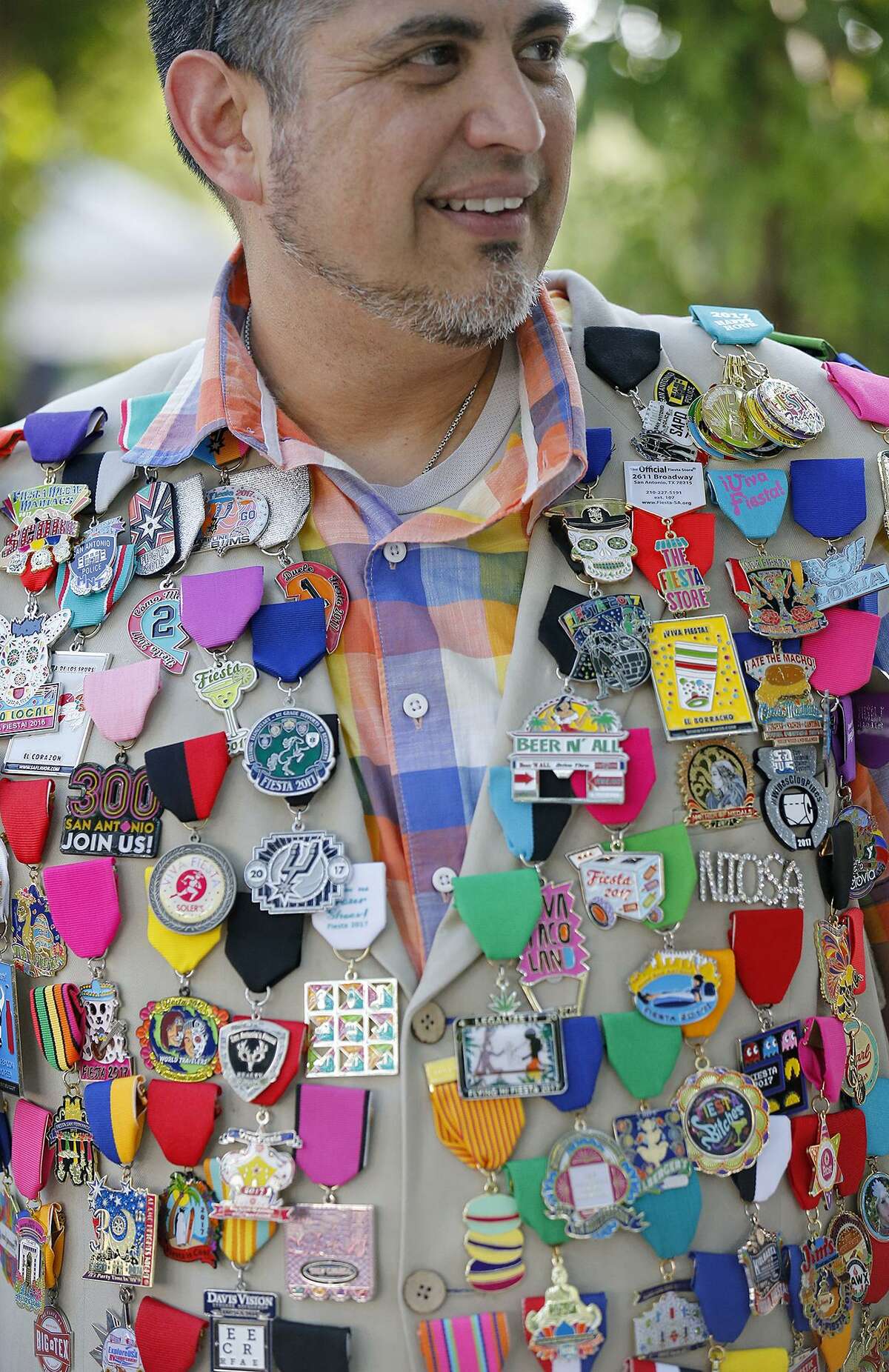 Buddy Sanchez wears medals on his vest during the Fiesta Fiesta event in 2017 at Hemisfair Park.