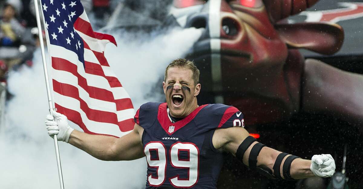 Houston Texans defensive end J.J. Watt carries a flag as he runs onto the field during pre-game ceremonies before an NFL football game between the Texans and the New York Jets at NRG Stadium on Sunday, Nov. 22, 2015, in Houston. ( Brett Coomer / Houston Chronicle )