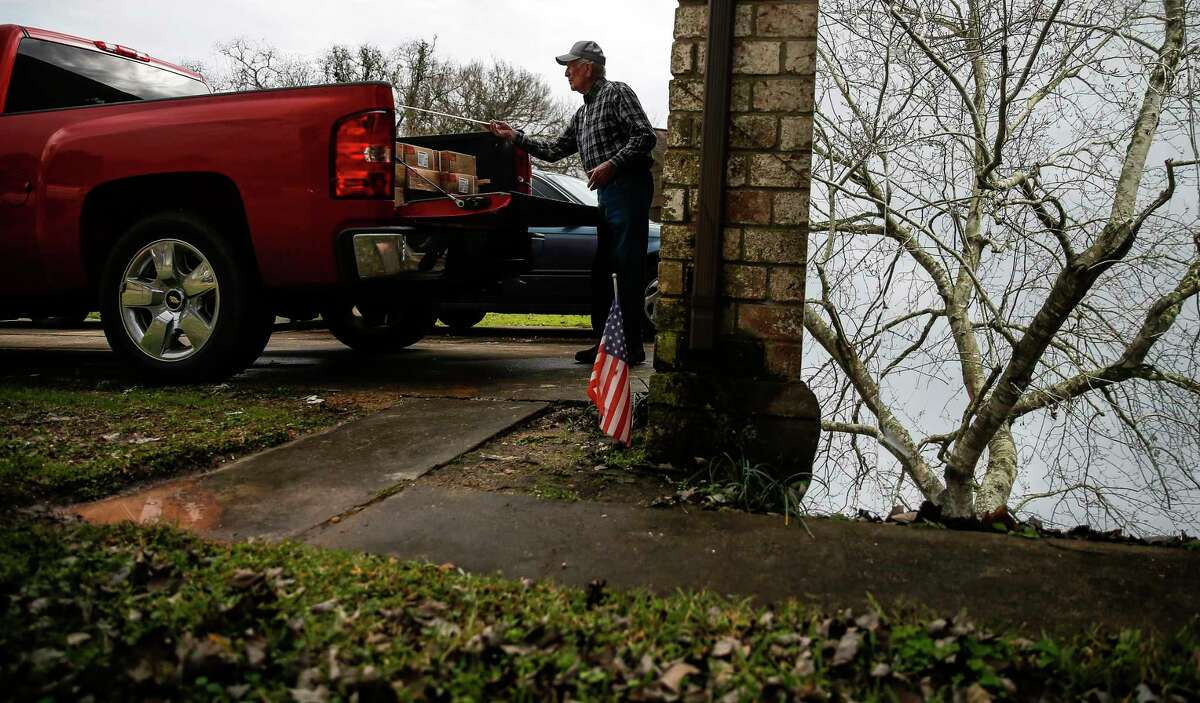 Homeowner James Unruh moves material into his truck Thursday, Jan. 11, 2018 as he works to repair his home that flooded during Hurricane Harvey in Friendswood. The city of Friendswood has reverted from 2007 flood maps to 1999 maps to allow homeowners that were flooded during the hurricane to rebuild without mandating expensive home elevation requirements. ( Michael Ciaglo / Houston Chronicle)