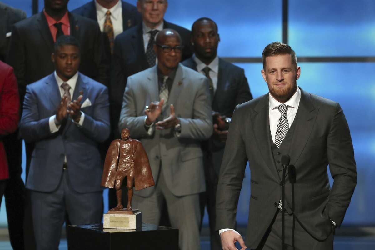 In this photo provided by the NFL, J. J. Watt of the Houston Texans, right, accepts the Walter Payton NFL Man of the Year Award at the 7th Annual NFL Honors at the Cyrus Northrop Memorial Auditorium on Saturday, Feb. 3, 2018, in Minneapolis. (Photo by Michael Zorn/Invision for NFL/AP Images)