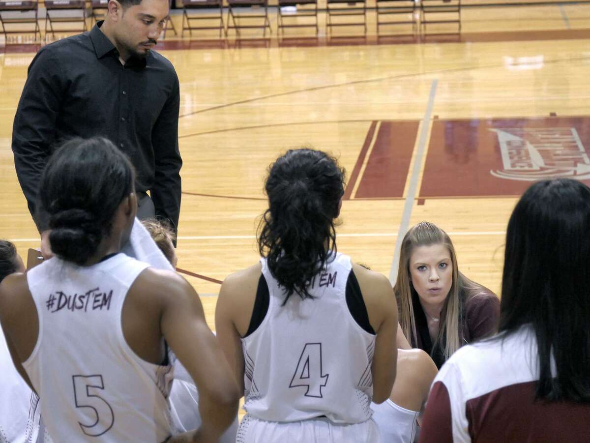 Assistant coach Tori Tucker, right, took over the TAMIU women’s basketball team during Saturday’s 69-46 loss to No. 2 Lubbock Christian. Sources told LMT that she would be taking over the program the rest of the season for Jeff Caha and that she would be assisted by men’s basketball assistant Jeremy Espinoza, left.