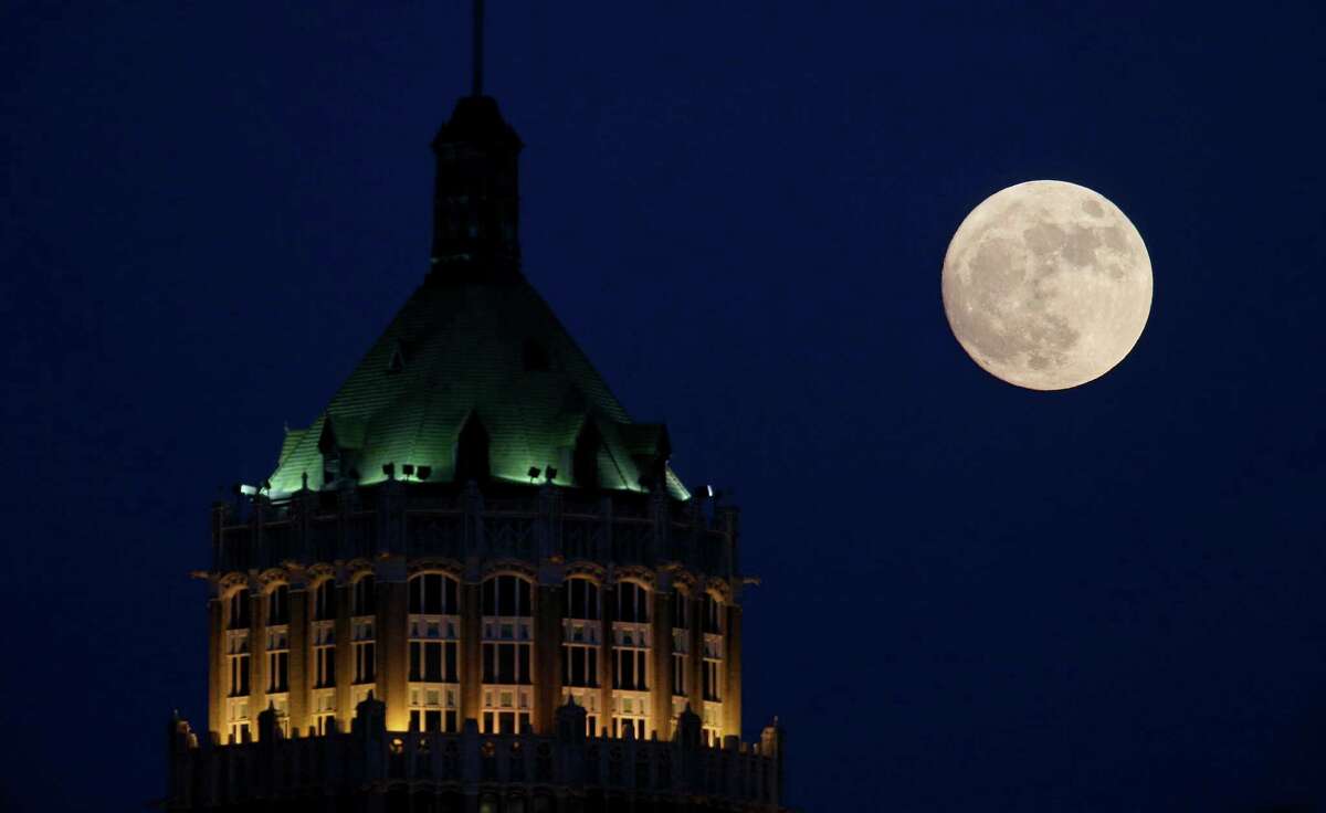A nearly full “Supermoon” is pictured behind the Tower Life Building on Nov. 13, 2016. The building is one that has been suggested for viewshed protection.