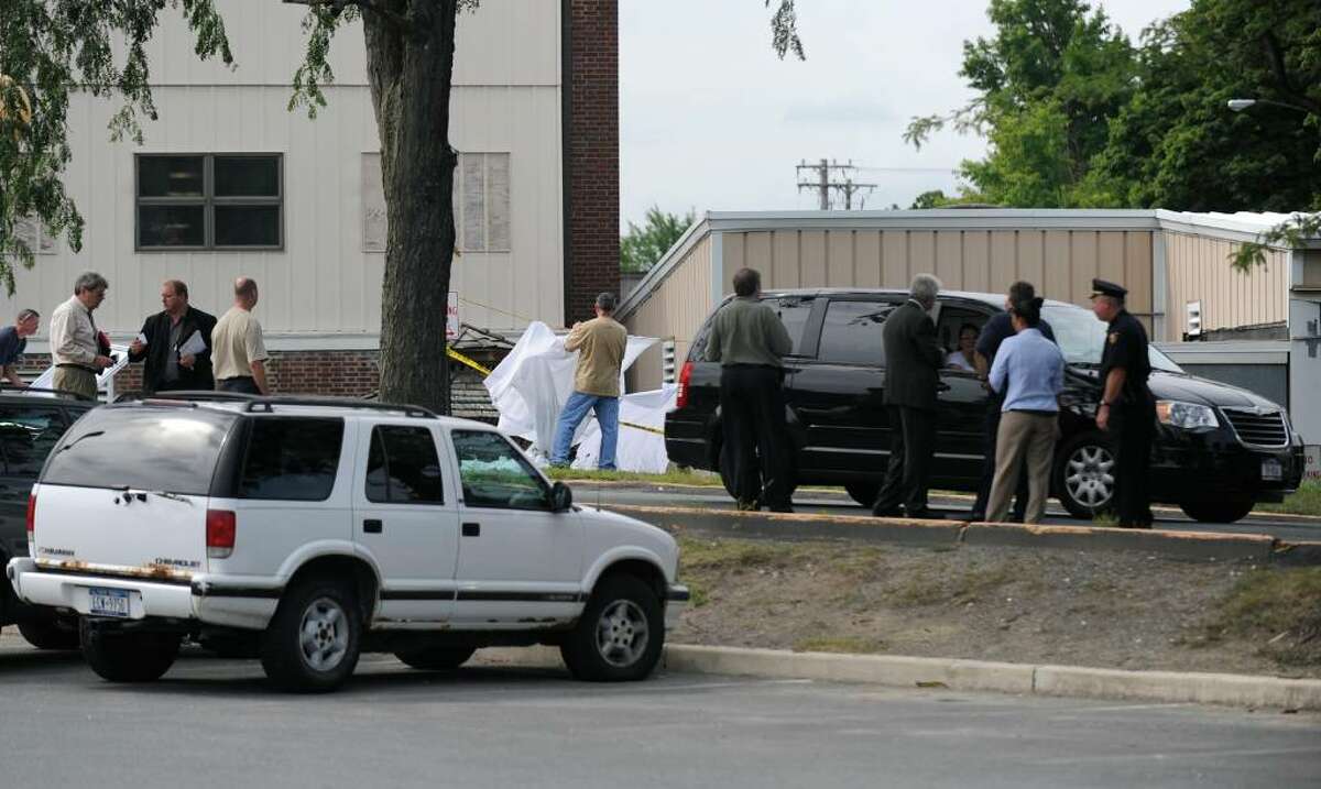 A hearse containing the body of the Maryland man who committed suicide on the grounds of the Samaritan Hospital, leaves the Emergency Room entrance in Troy, Wednesday morning. (Skip Dickstein / Times Union)