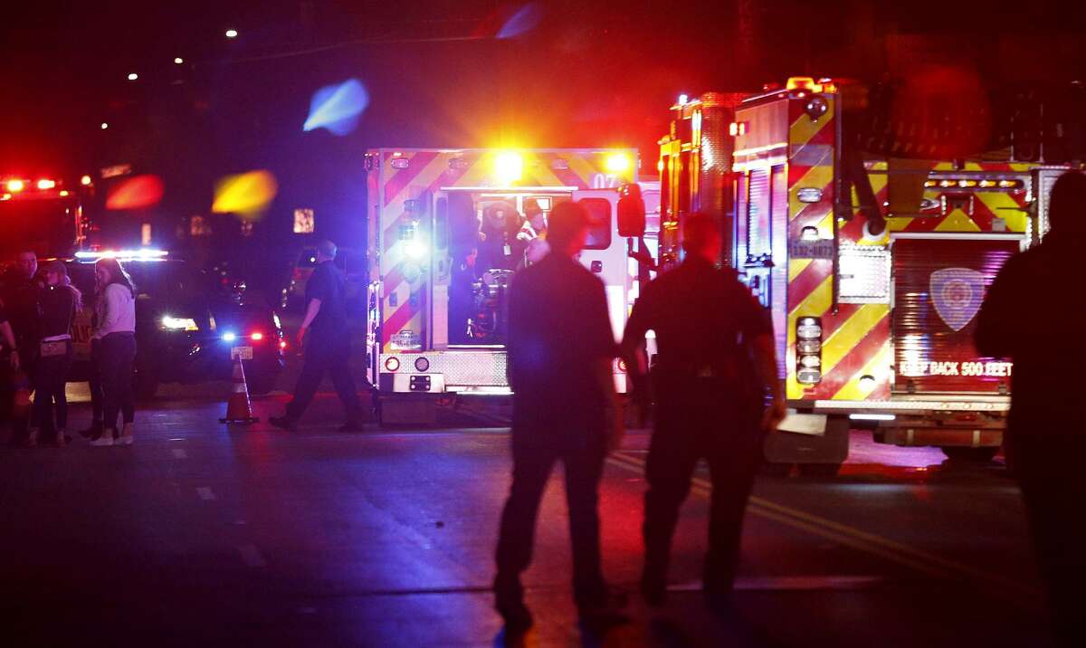 First responders attend to a woman hit by a vehicle Sunday Feb. 4, 2018 across from The Friendly Spot.
