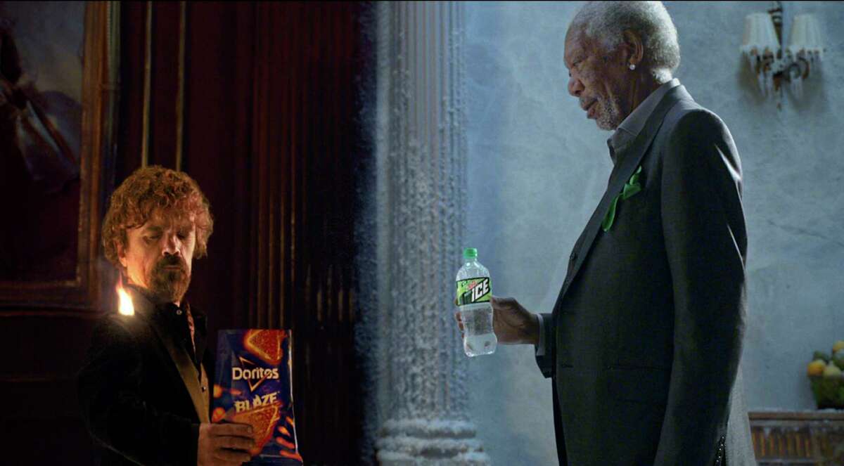 This photo provided by PepsiCo shows Peter Dinklage and Morgan Freeman in a scene from the company's linked Doritos Blaze and Mountain Dew Ice Super Bowl spots. For the 2018 Super Bowl, marketers are paying more than $5 million per 30-second spot to capture the attention of more than 110 million viewers. (PepsiCo via AP)