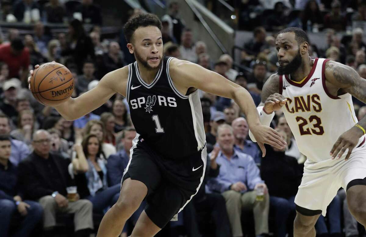 San Antonio Spurs forward Kyle Anderson (1) drives around Cleveland Cavaliers forward LeBron James (23) during the second half of an NBA basketball game, Tuesday, Jan. 23, 2018, in San Antonio. San Antonio won 114-102.