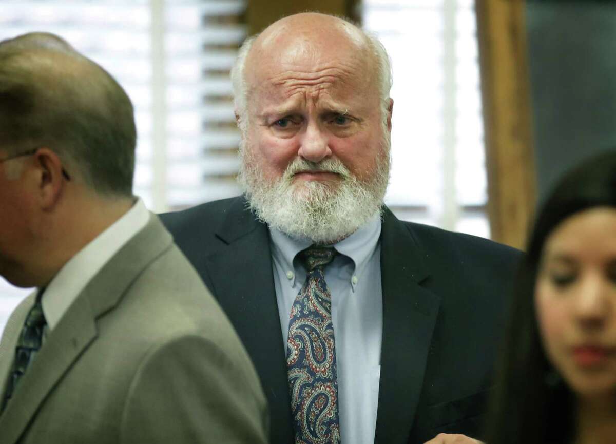 Timothy Mott, listens to his wife Sharlotte Mott, after she testified on the sixth day of testimony in the civil case against MPII, which does business as Mission Park Funeral Chapels and Cemeteries, accused of losing a body from a casket in 2015, in the 131st Civil District Court on Tuesday, Feb. 6, 2018.